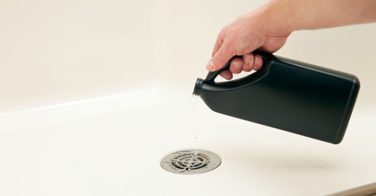 pouring chemicals down drain